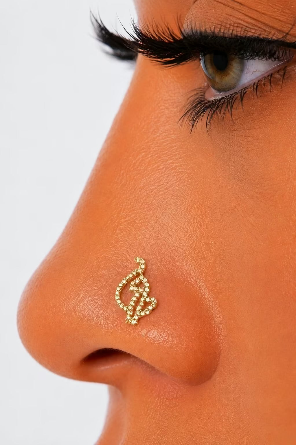 Gold Baby phat nose piercing